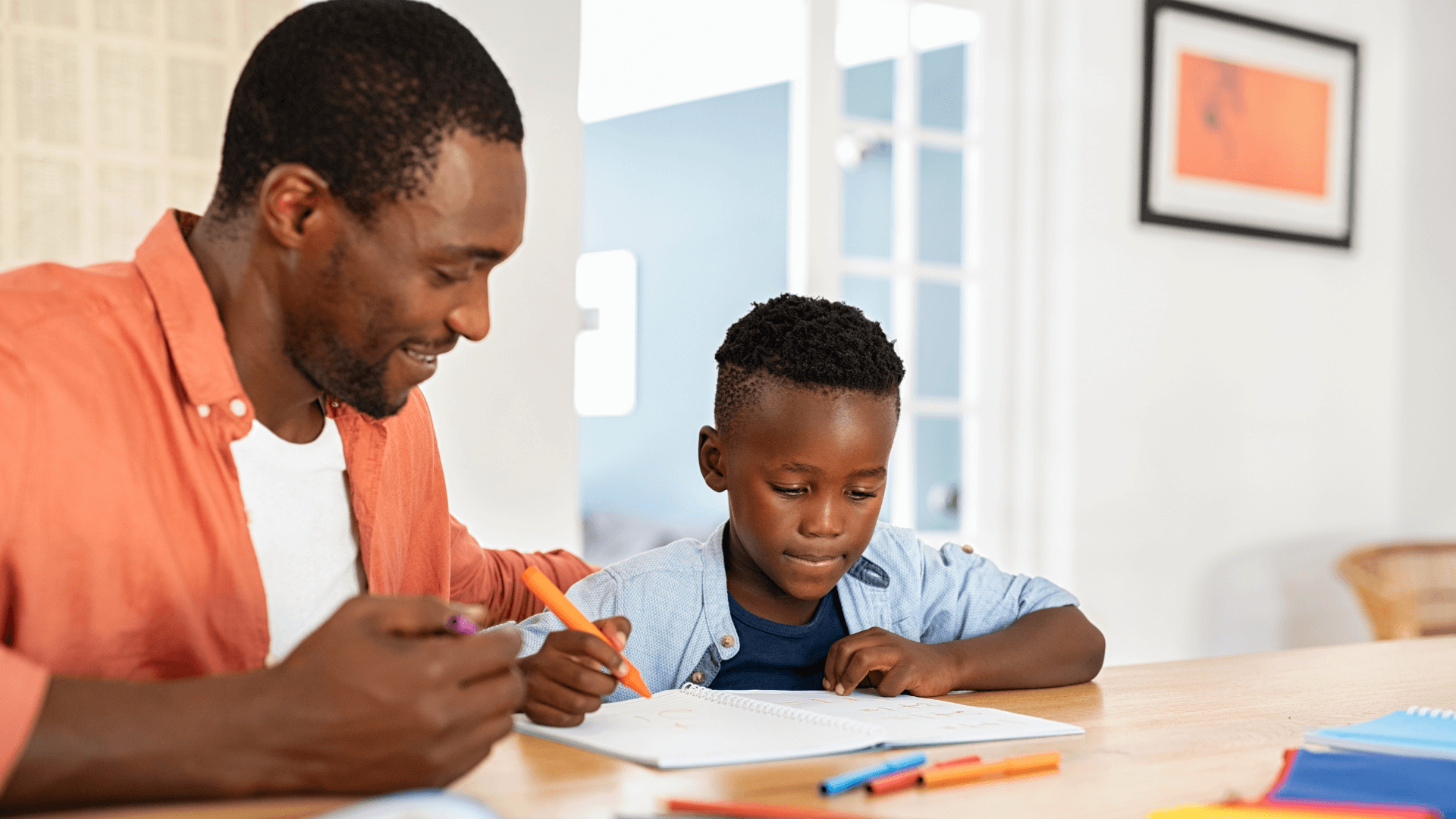 A parent helping their child with a drawing activity at home, fostering creativity and bonding